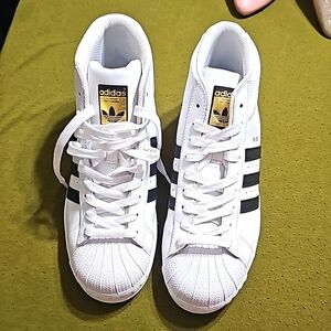 White sneakers by adidas